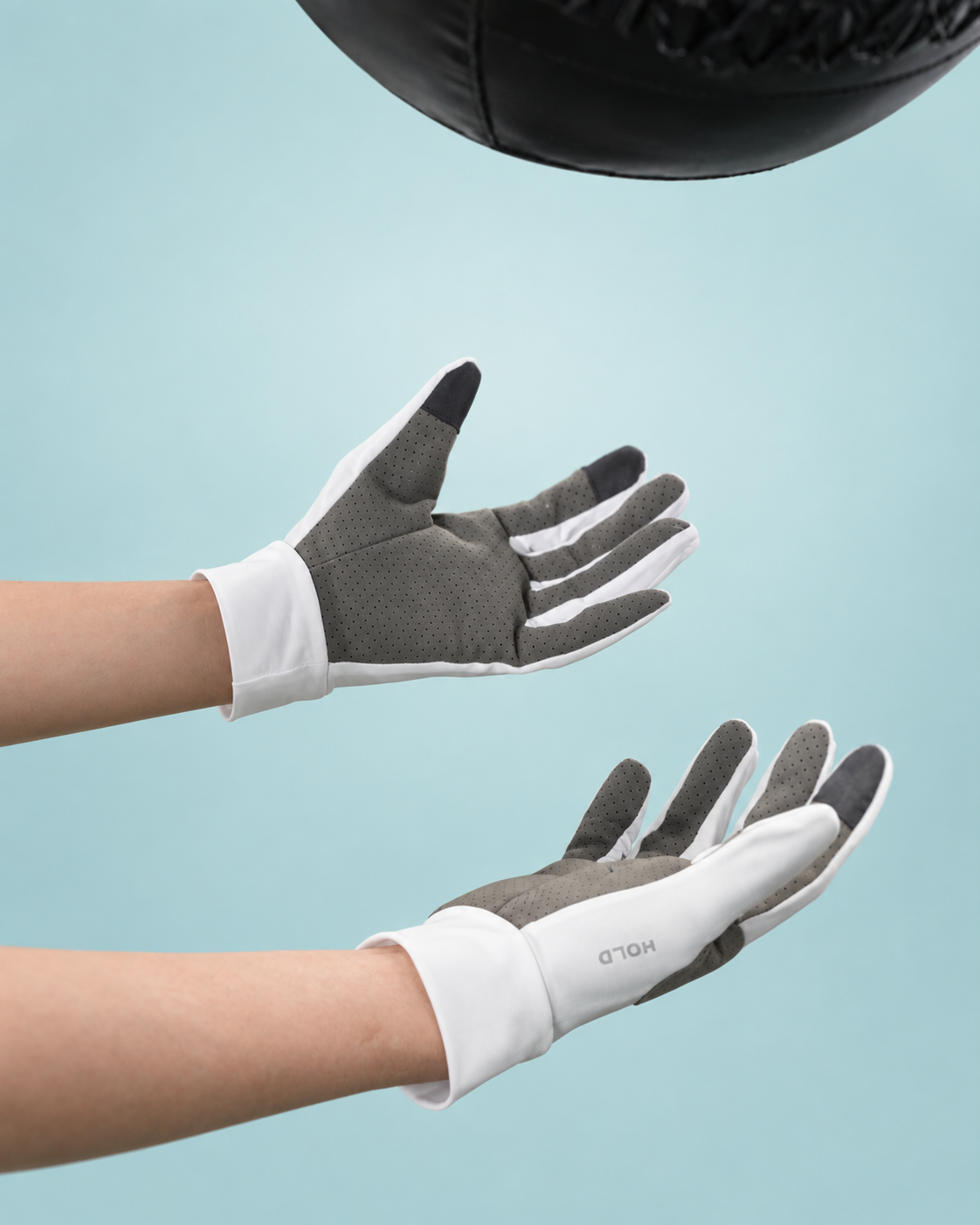 Both HOLD gloves held out palm up, showing the grey microfiber palm.